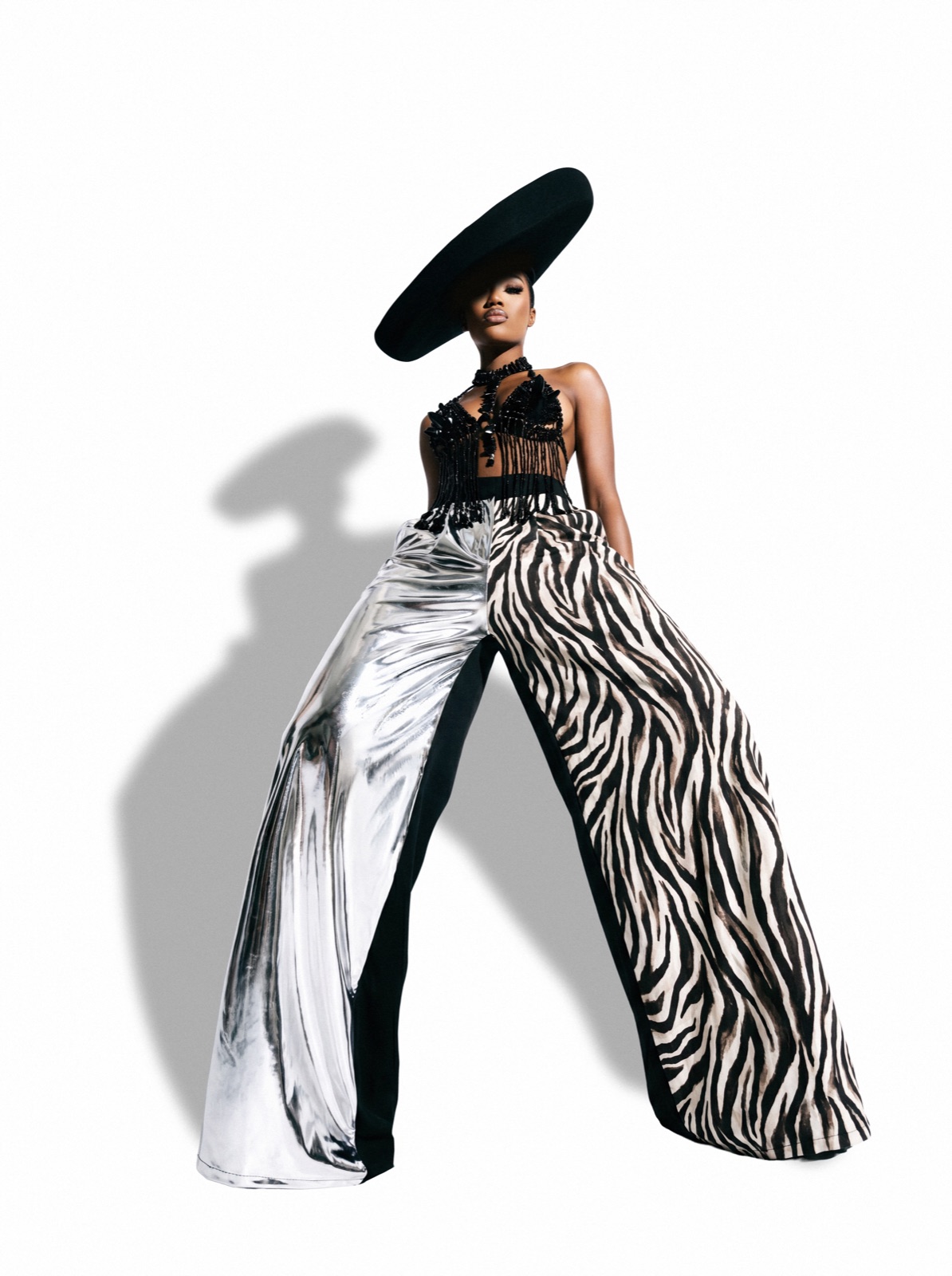 Concept editorial fashion photography Jacksonville FL — wide brim hat with liquid silver and zebra split palazzo, studio editorial by HiDef Pixel